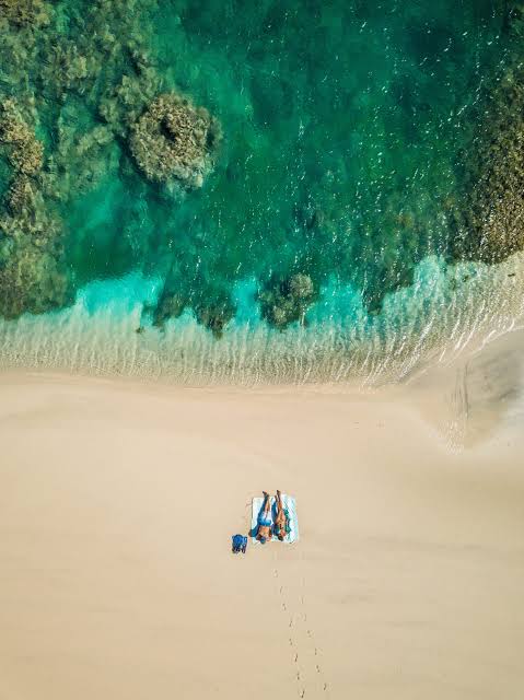 Aerial view of a private beach beside turquoise water, Madagascar