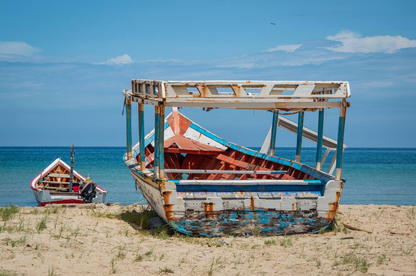 Traditional wooden fishing boats on a Lake Malawi beach, part of the private safari circuit's final stop